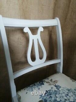4 vintage dining chairs newly upholstered and painted in a pale grey