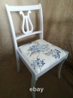4 vintage dining chairs newly upholstered and painted in a pale grey