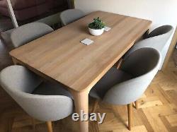 6 dining chairs by MADE. Com in grey upholstered fabric. Barely been used