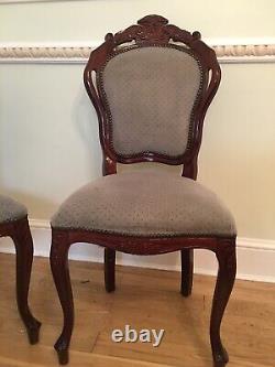 A Set of 4 Rosewood Dining chairs with Grey Upholstery