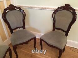 A Set of 4 Rosewood Dining chairs with Grey Upholstery