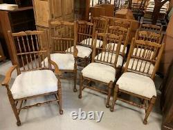 A Set of Ten Solid Oak Upholstered Spindle Back Dining Chairs
