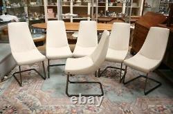 A set of six Rolf Benz cream leather upholstered dining chairs