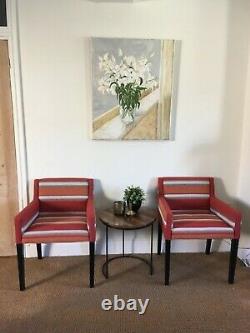 A stylish and striking pair of upholstered chairs in Warwick Cheveyo fabric