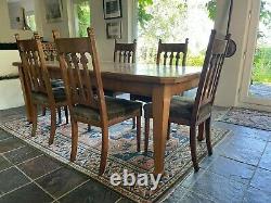 Arts & Crafts Dining Suite. Extending Table & Six Oak Upholstered Dining Chairs