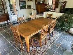 Arts & Crafts Dining Suite. Extending Table & Six Oak Upholstered Dining Chairs