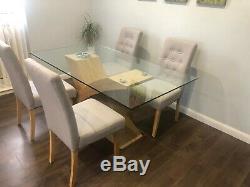 Beautiful Glass Dining Table With 4 Upholstered Chairs