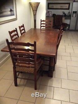 Dining table and 6 ladderback upholstered chairs, solid oak