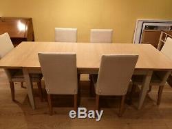 Ercol Pinto oak extending dining table and 6 upholstered chairs