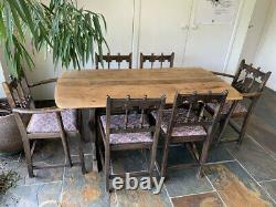 Ercol dining table and chairs, four chairs 2 carvers, darkoak, upholstered seats