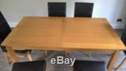 Extendable oak dining table and 6 leather upholstered oak chairs