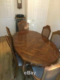 Extending, solid wood, walnutt dining table & 6 chairs (recently re upholstered)