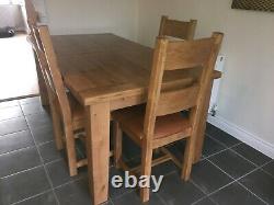 Farmhouse Solid oak extendable dining table with six leather upholstered chairs
