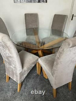 Glass top Wooden dining table and 6 matching Upholstered Grey Chairs