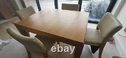 Habitat Used solid oak extending dining table and 8 upholstered chairs