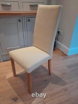 High backed, cream upholstered M&S dining room chairs x 4 with fireproof labels