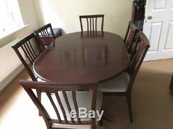 Nathan extending dining table and six upholstered chairs