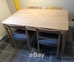 Oak Efni Extending Dining Table & 4 Grey Upholstered Chairs. Debenhams, Scandi