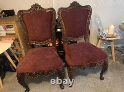 Pair of antique Baroque upholstered hand carved dining chairs