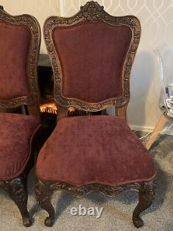 Pair of antique Baroque upholstered hand carved dining chairs