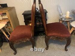 Pair of antique Baroque upholstered hand carved dining chairs