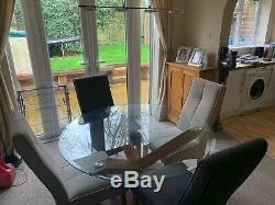 Round glass dining Table with Chunky Solid Oak Legs and 4 upholstered chairs