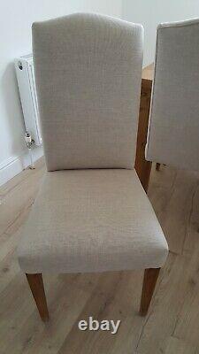 Set of 8 quality Dining Chairs recently re-upholstered in natural linen