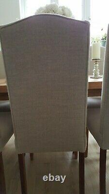 Set of 8 quality Dining Chairs recently re-upholstered in natural linen