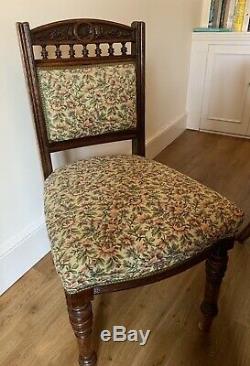 Six Antique Upholstered Dining Chairs with Carved Backs