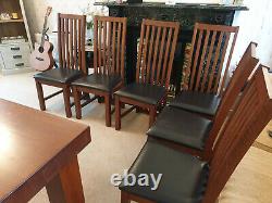 Solid Oak Dining Room table and 6 brown leather upholstered Dining Chairs