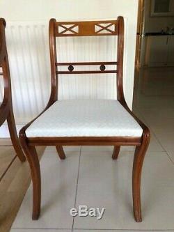 Solid Wood Yew Dining Table and Eight upholstered Chairs excellent condition