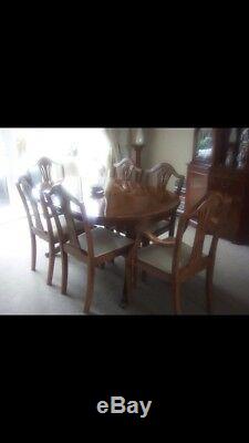 Solid Wood Yew Extending Dining Table and Six upholstered Chairs Good condition