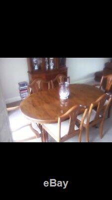 Solid Wood Yew Extending Dining Table and Six upholstered Chairs Good condition
