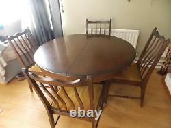 Stag dining table and 4 upholstered chairs