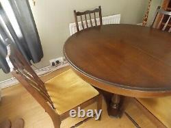 Stag dining table and 4 upholstered chairs