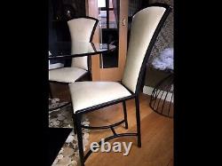 Statement Leather Upholstered Metal dining chairs, by Tom Faulkner