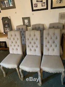 Upholstered dining chairs with buttons