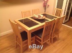 Wooden Dining Table with granite inserts and Six Upholstered Chairs