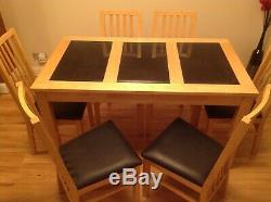 Wooden Dining Table with granite inserts and Six Upholstered Chairs
